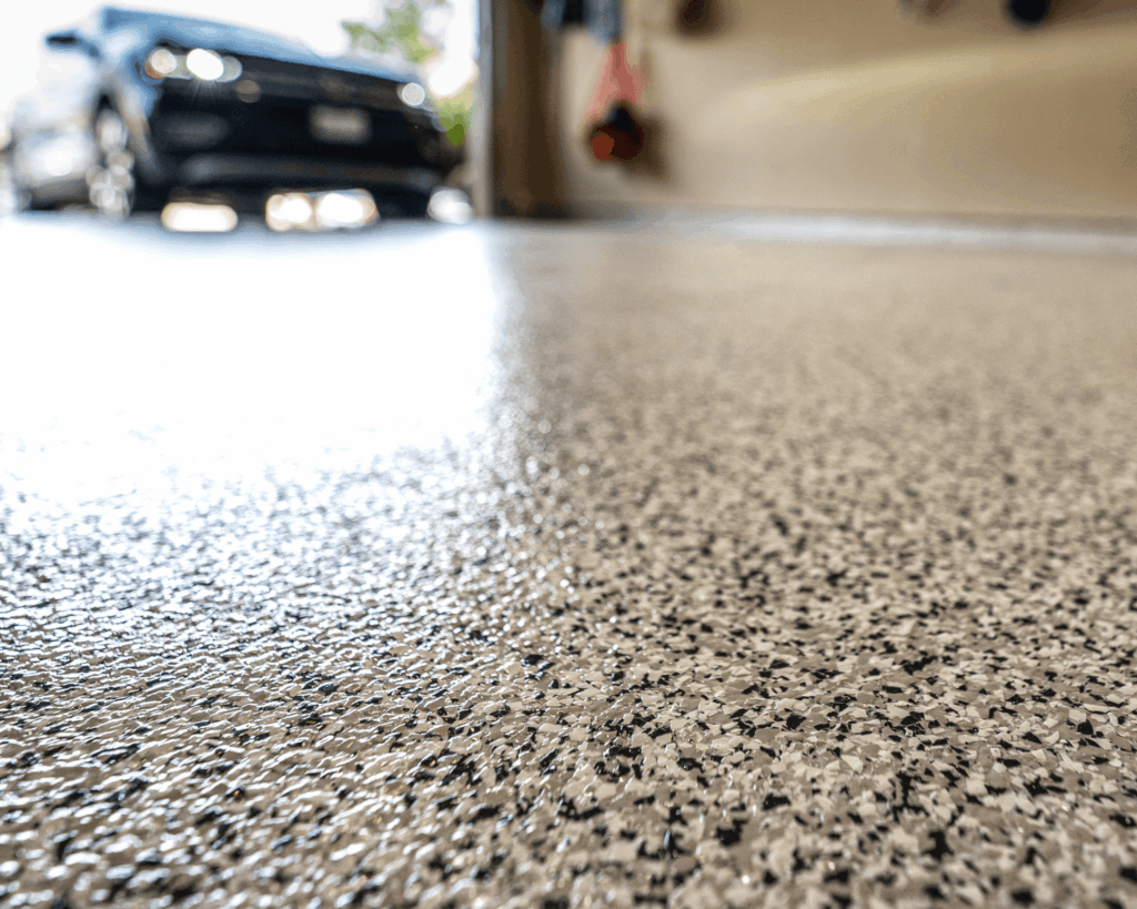 a close up of new garage epoxy flooring installed by garage up technicians