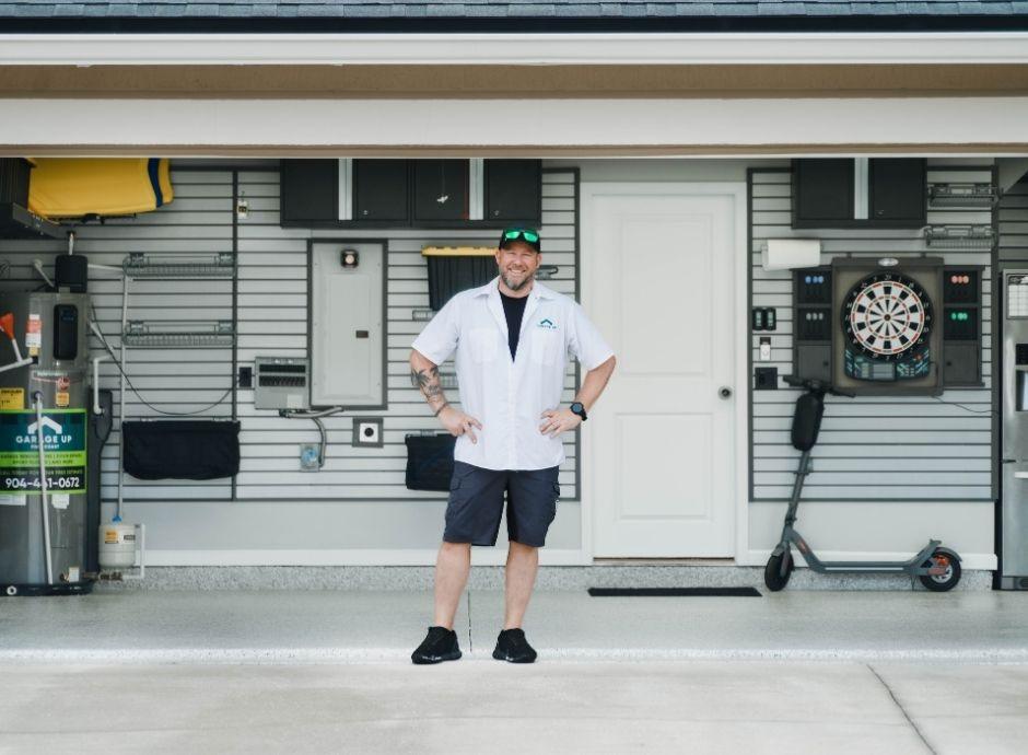 The owner of Garage Up First Coast is posing for a photo.