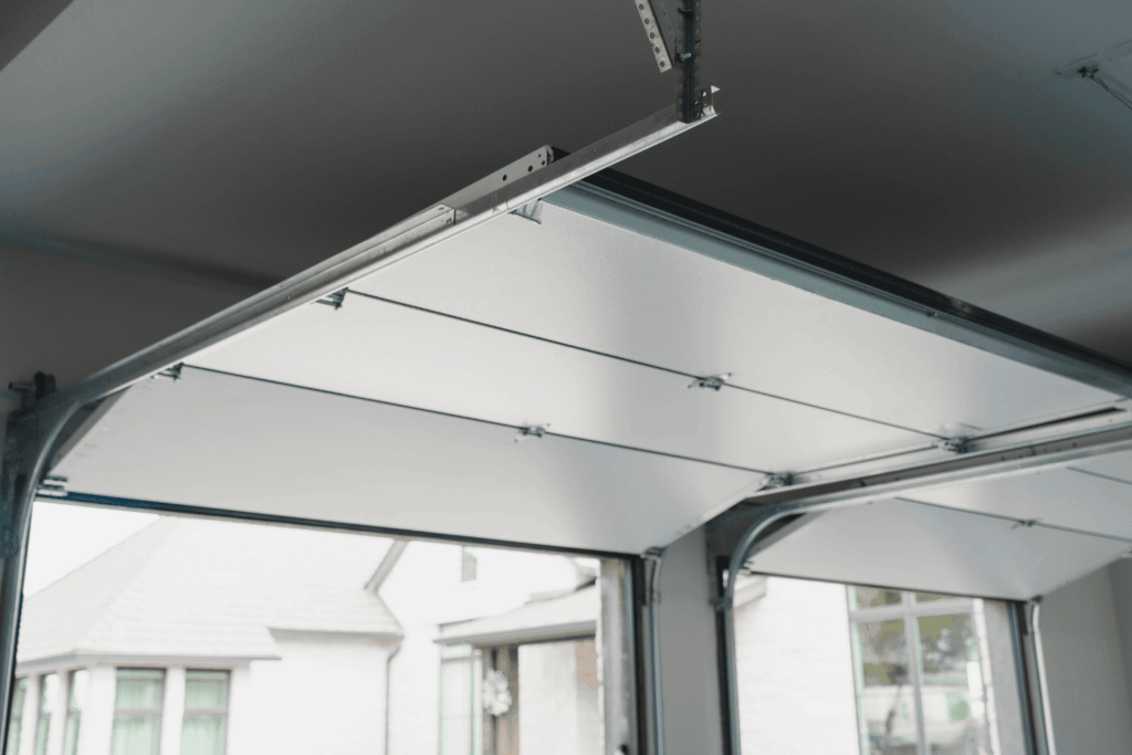 Two newly installed steel insulated garage doors opened_Garage Up