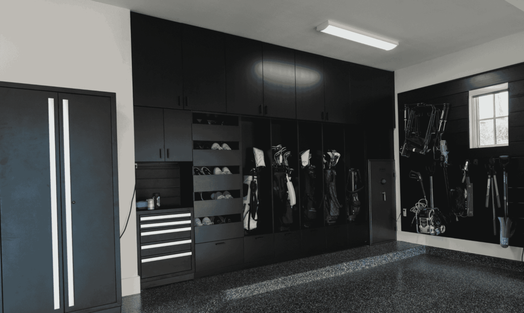 Modern garage with custom cabinets installed as part of professional organized garage storage solutions.