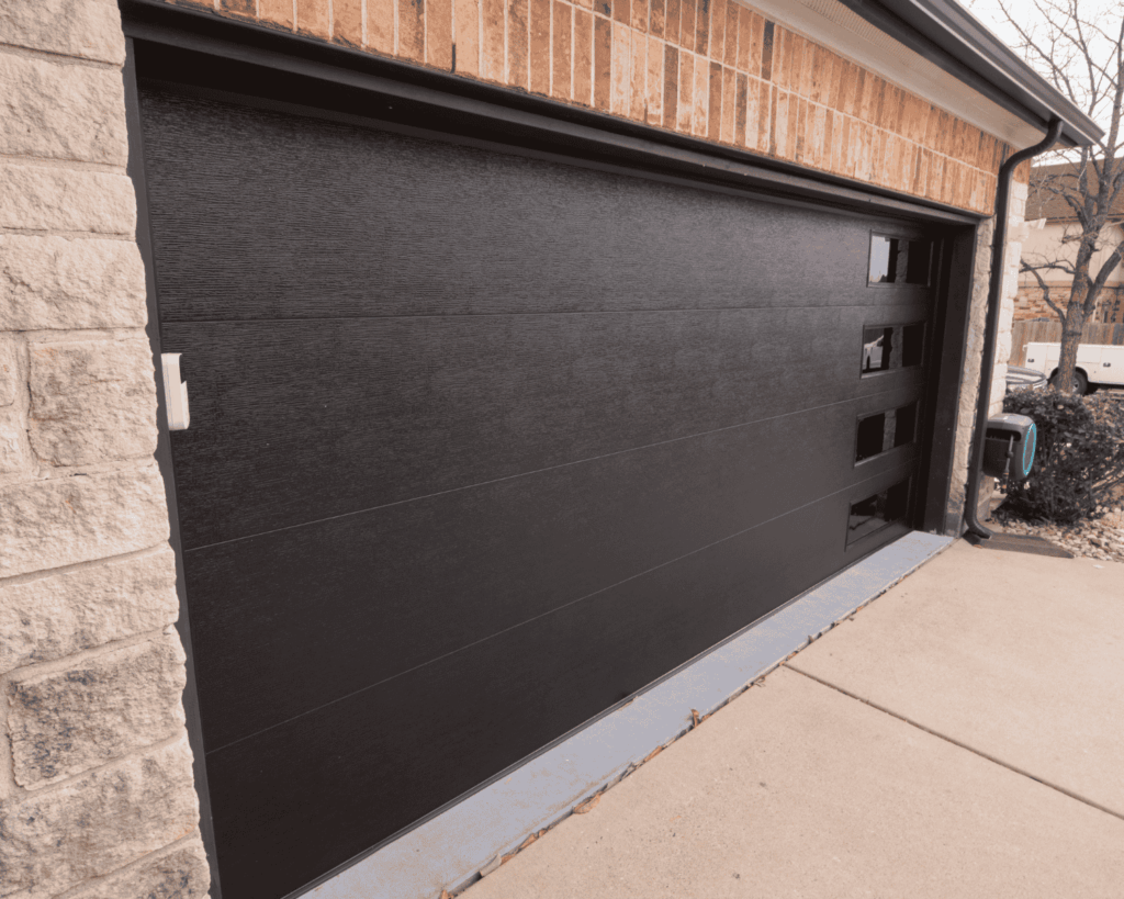 A brown garage door that was just painted - garage renovations in the grove