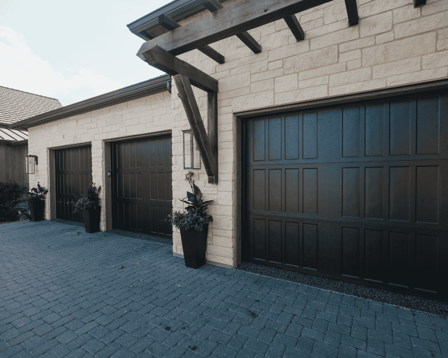 a three door dark brown garage