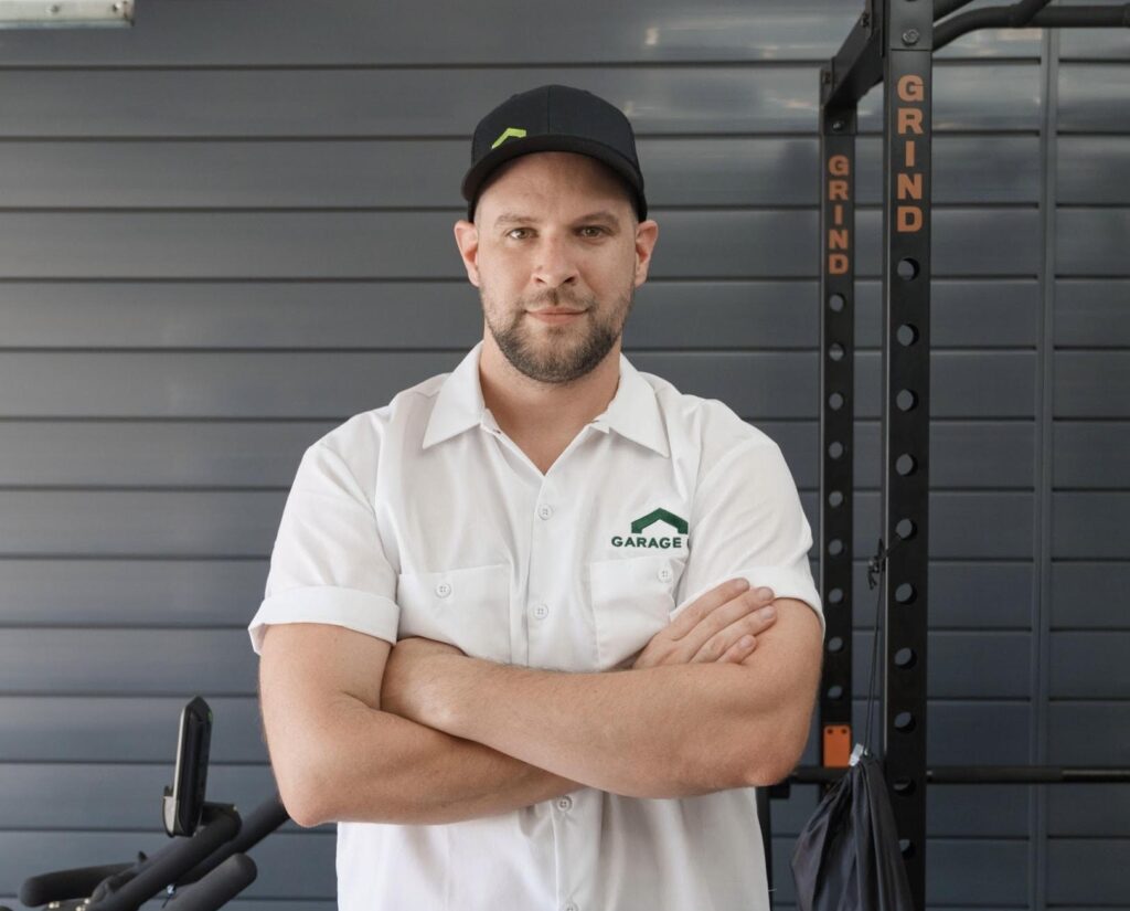 A Garage Up owner posing in a freshly renovated garage.