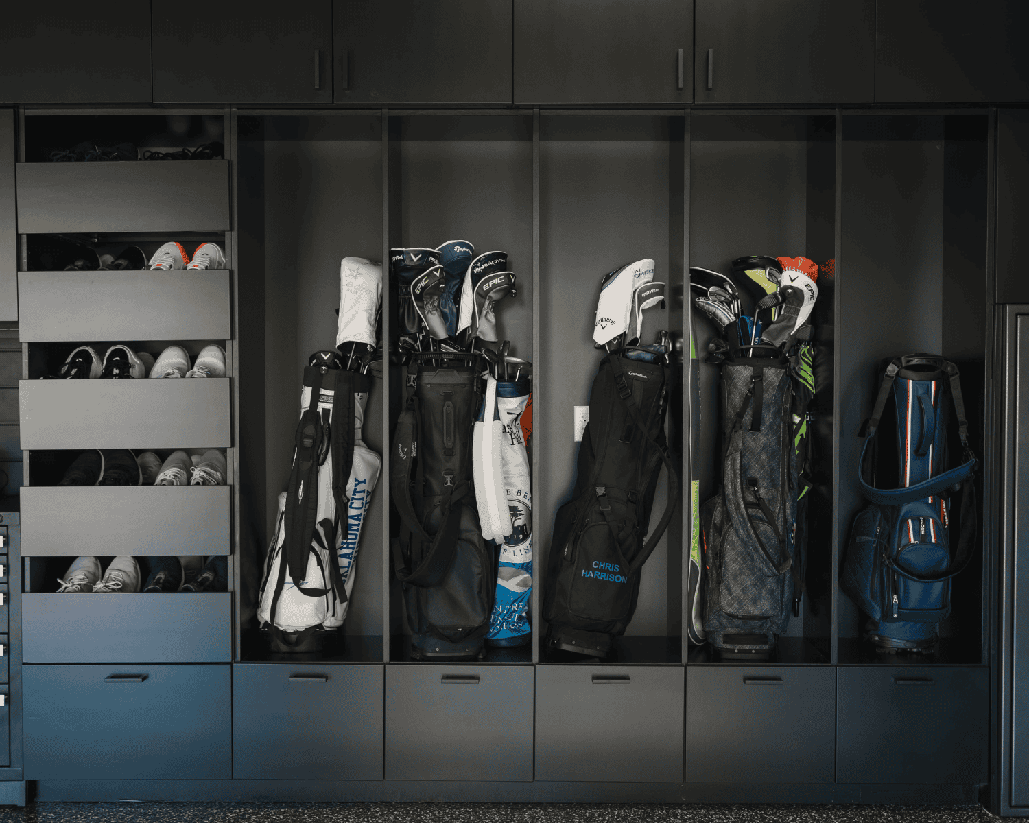 Newly installed Husky cabinets with golf equipment inside of each compartment, installed by Garage Up