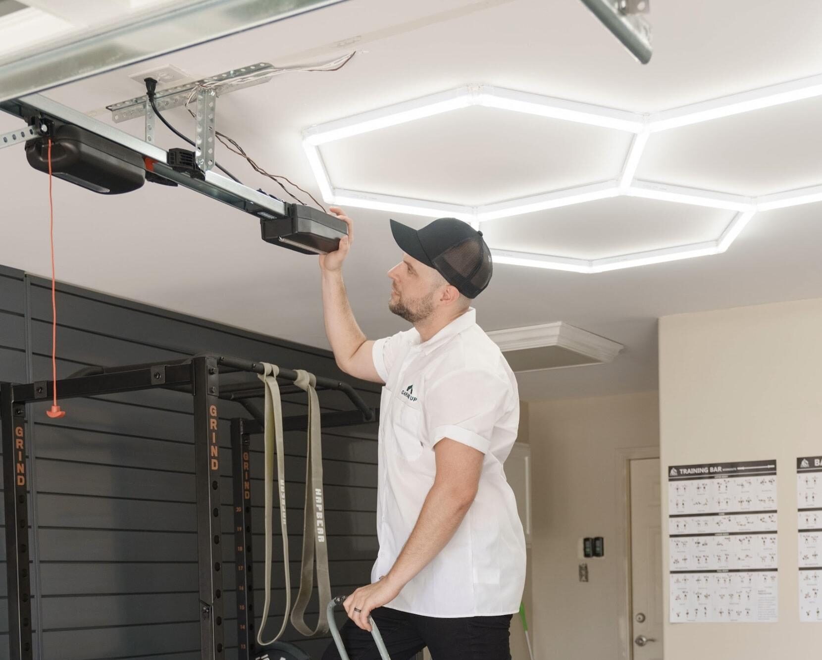 Garage Up team installing a garage door motor. garage door installation