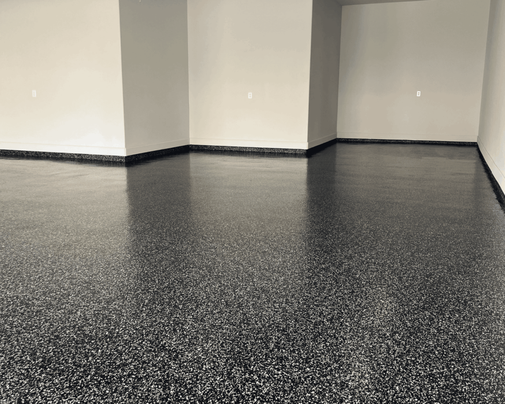An image of a finished epoxy floor in a garage renovation project.
