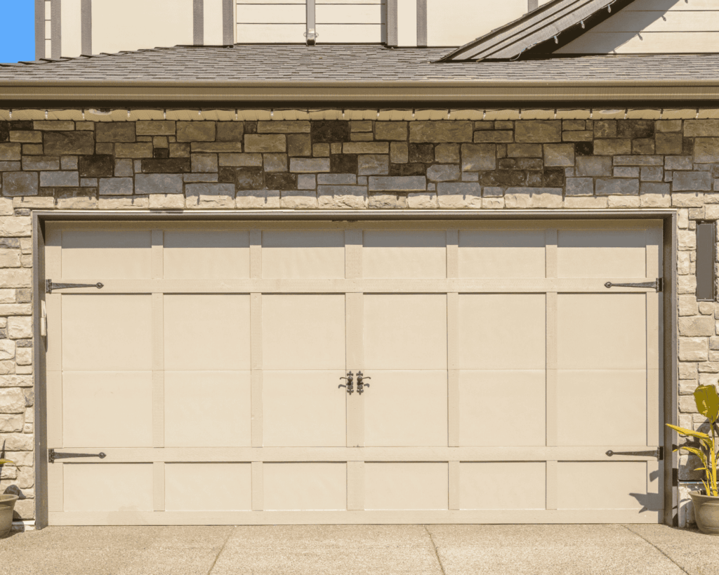 a beige carriage two door garage
