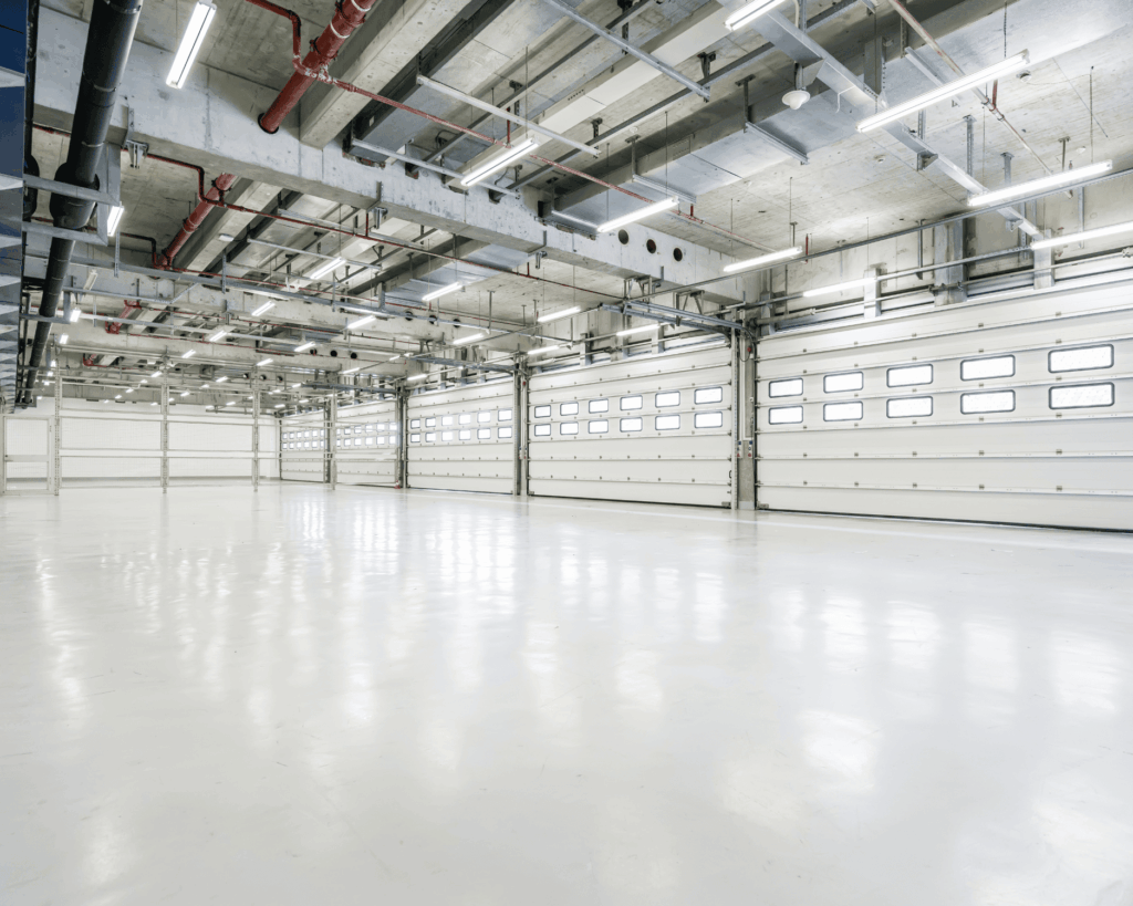 a commercial facility with large garage doors and new commercial flooring