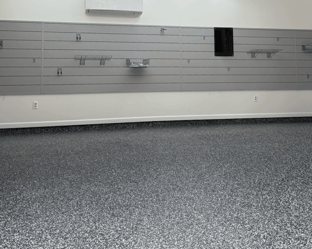a newly renovated business garage with new epoxy floors and slat walls
